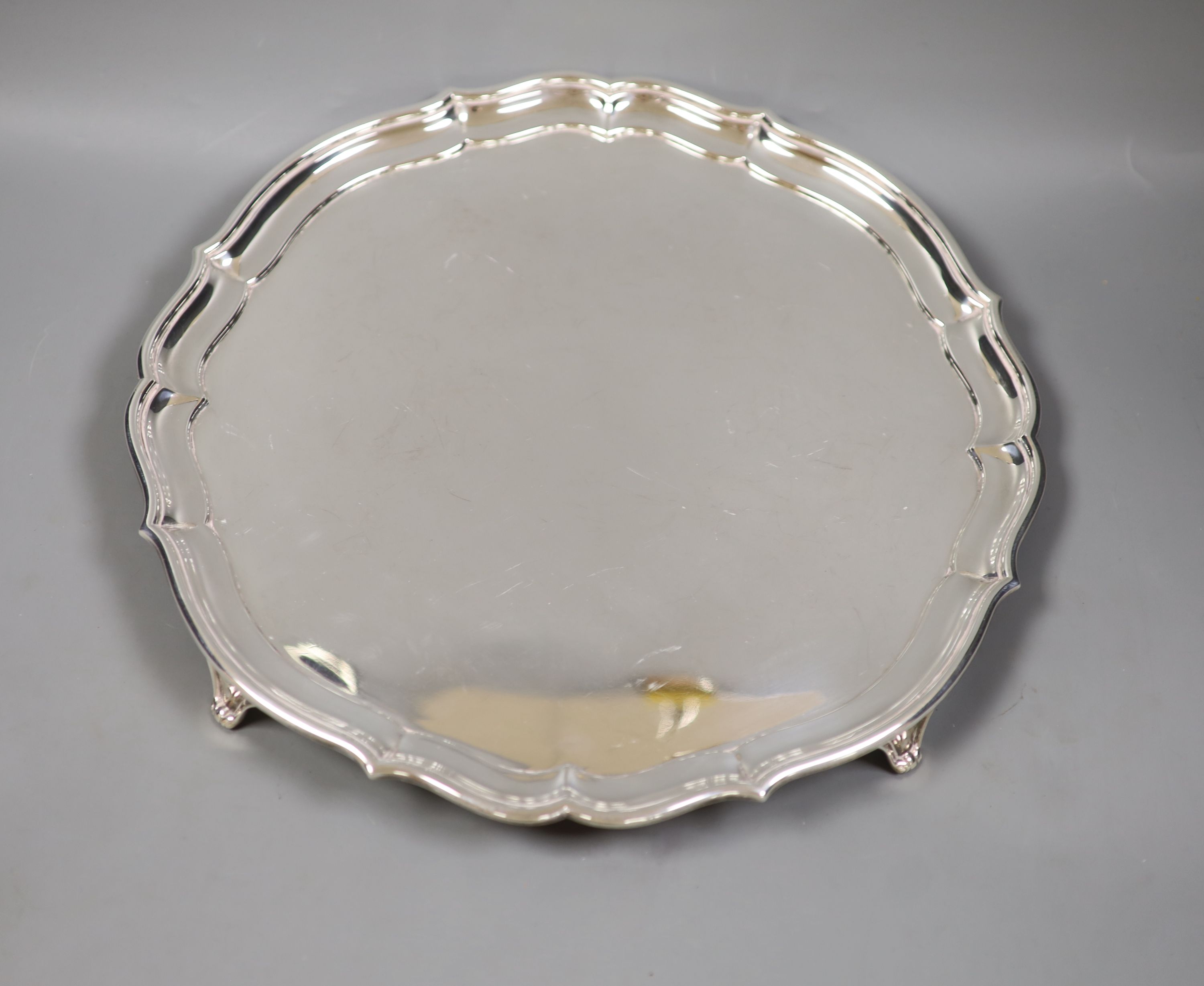 A circular silver salver